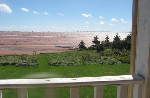Chelton House | Winterized beachfront cottage with fireplace, screened in porch and deck