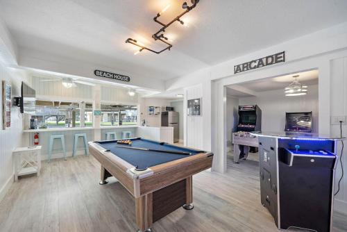 Canal Front Home with Boat Slip, Game Room, and Great Water Views