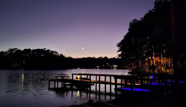 Escape to our serene lakefront cottage & vineyard with stunning views!