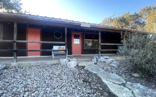 Family Cabin Getaway with an Outdoor Fireplace near Lake Granbury in Texas