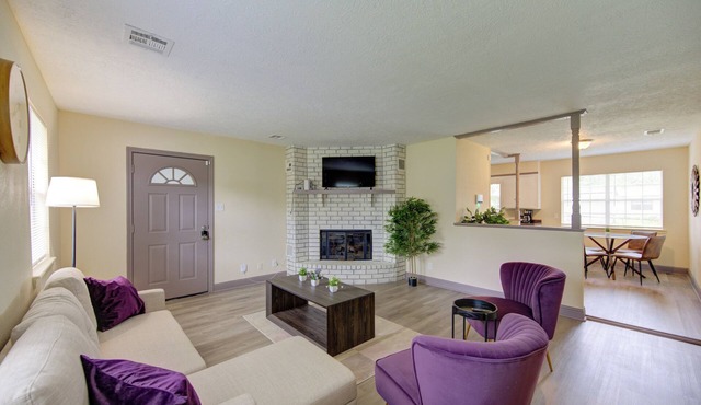Indoor fireplace with patio and pool table