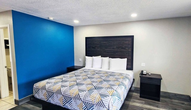 King Bed Non-Smoking Room at Scottish Inns and Suites Wharton
