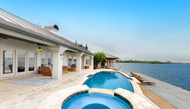 Luxe lakefront retreat with private pool, spa, lakeside terrace, gourmet kitchen
