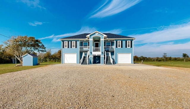 Private acreage next to the bayou with kayaks, porches, open layout, W/D, & AC