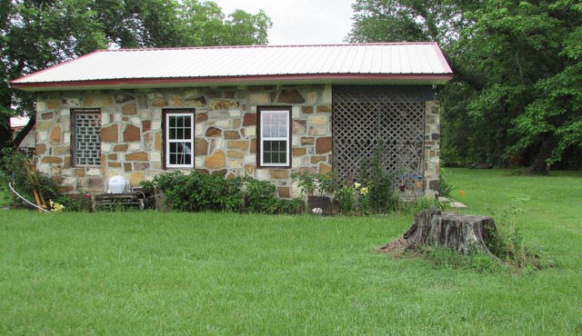 Restored rock house with hot tub and beautiful private deck.