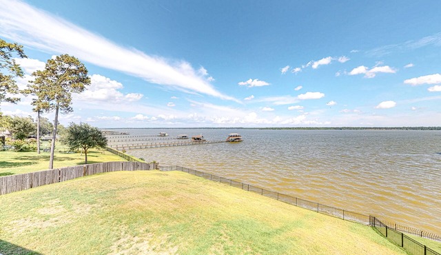 Spacious lakefront home with patio, grill, W/D, WiFi, & central AC