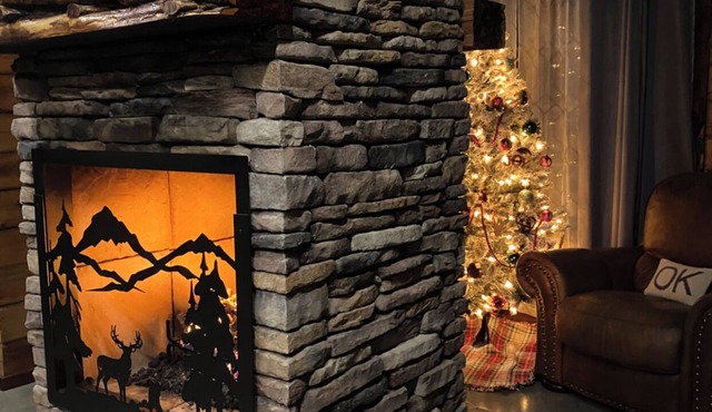 The Cozy Pines is a newly built, romantic log cabin with a 2-sided fireplace.