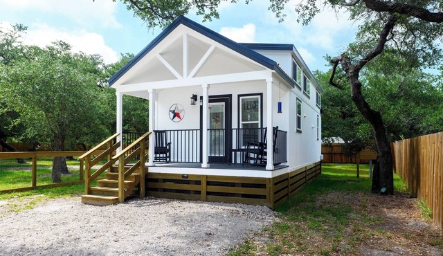 The Live Oak Tiny House with fence