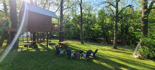 Tree House Glamping Destination near the Ozarks, with River Access for Swimming and Fishing