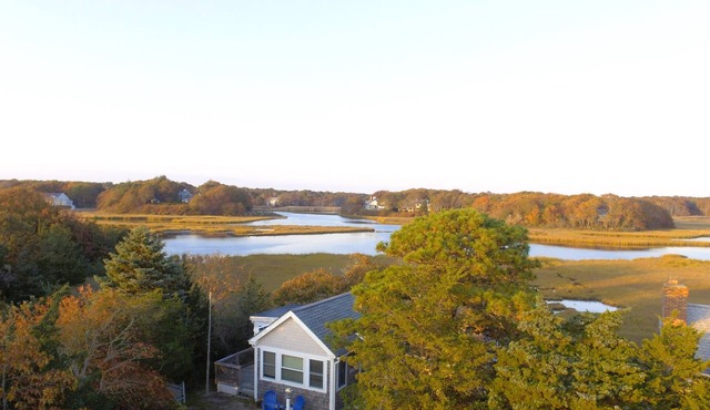 Waterfront! Riverfront delight. 2 BR, private, decks. Steps to Craigville Beach in Barnstable