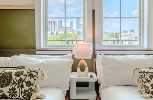 East Cesar Chavez House | Unit 2+3 Inn Cahoots on 6th: 10BR/26 Bed - Pool, Roofdeck, Garden Bars, Walk To Everything!