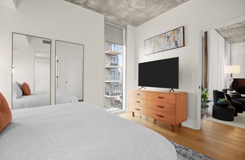 Rainey Street Historic District Condo | Designer Condo Steps to Lady Bird Lake with gym & rooftop pool